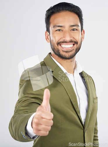 Image of Happy asian man, portrait and thumbs up in winning, success or thank you against a white studio background. Businessman smile with like emoji, yes sign or OK in agreement, good job or approval