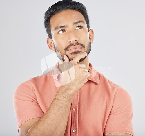 Image of Thinking, face and asian man in studio for planning, choice or questions on grey background space. Idea, why and Japanese male model confused by decision, brainstorming or problem solving doubt emoji