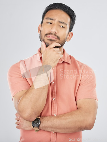 Image of Confused, thinking and asian man in studio for planning, decision or questions on grey background space. Idea, why and Japanese male model with choice, brainstorming or problem solving doubt emoji