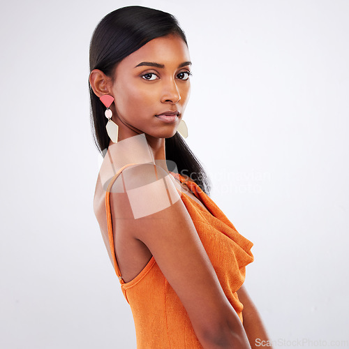 Image of Portrait, fashion and serious woman in dress at studio isolated on a white background mockup space. Face, style and confident Indian model in formal clothes for party, event and elegant aesthetic