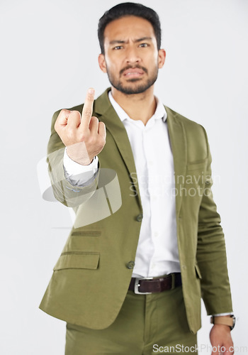 Image of Business man, middle finger and portrait with angry, conflict and emoji hand sign in studio. Professional, worker and hate with a white background and frustrated with rude and rejection gesture