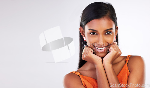 Image of Beauty, happy and portrait of Indian woman in studio with makeup, cosmetics and glamour on mockup space. Smile, aesthetic and face of person on white background with glow, wellness and confidence