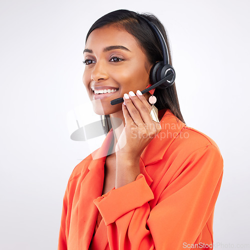 Image of Call center, listening and happy woman telemarketing, support and help in studio isolated on a white background. Contact us, customer service agent and sales consultant on mic for thinking of crm.