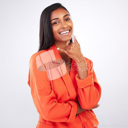 Image of Portrait, hands and business woman for call me in studio for contact us, faq or service on grey background. Face, smile and lady consultant with phone sign for calling, communication or get in touch