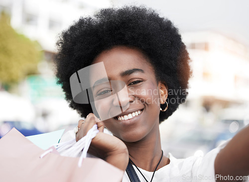 Image of Woman, selfie and shopping bag outdoor for social media, student sale and happy portrait in city. Face of young african person or influencer smile in profile picture photography for retail or gift