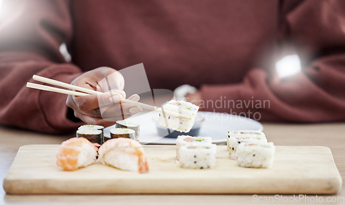 Image of Sushi, seafood and health with hands of person in store for brunch, Japanese cuisine and menu. Fish, salmon and restaurant with closeup of customer eating for nutrition, Asian diet and fine dining