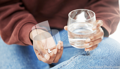 Image of Closeup, water and woman with tablets, medicine and nutrition supplements with vitamins, care and health. Zoom, person and girl with a glass, pills and medication for virus with treatment and illness