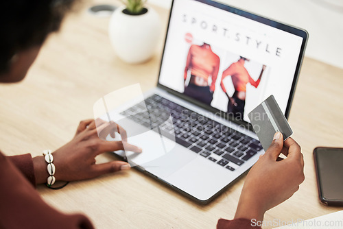 Image of Woman, hands and laptop with credit card in online shopping, payment or banking on fashion at office. Closeup of female person with debit on computer in ecommerce, buying or fintech at the workplace