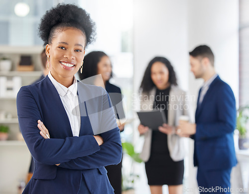 Image of Crossed arms, confidence and portrait of professional black woman in the office with a smile. Happy, career and young African female attorney with pride standing by a legal team in the workplace.