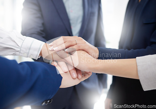 Image of Hands, stack and business people, meeting and support with solidarity, corporate community and team huddle. Mission, collaboration and partner, commitment and group of employees working together