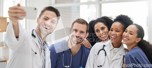 Image of Doctor, selfie and group with smile for social media and profile picture in hospital. Healthcare, nurse staff and clinic with teamwork, collaboration and happy smile from medical work and employees