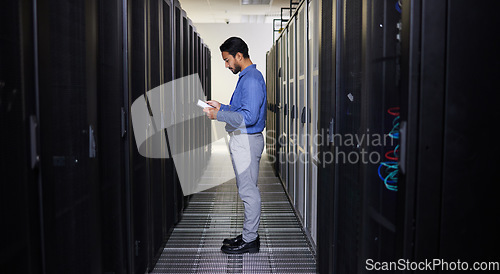 Image of Tablet, man and technician in data center on research for programming at night. Information technology, inspection and engineer in server room reading, network maintenance or typing code for software