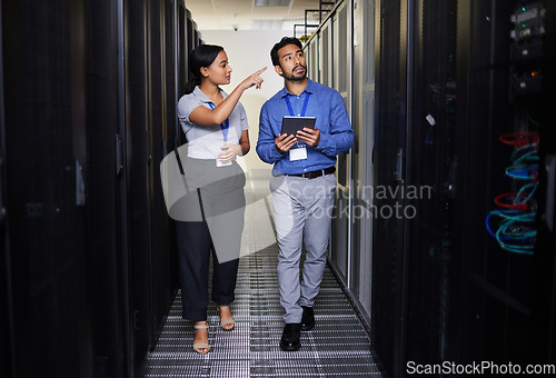 Image of People, server room and inspection or teamwork for cybersecurity, engineering and coding solution on tablet. Engineering man and woman or manager walking and check data center with digital technology