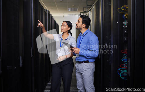 Image of People, server room and engineering teamwork, inspection and tablet for cybersecurity, power or coding solution. Electrician man and woman or manager show or check data center with digital technology