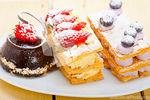 Image of selection of fresh cream cake dessert plate