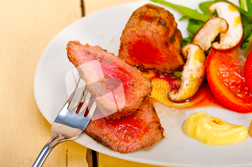 Image of beef filet mignon grilled with vegetables