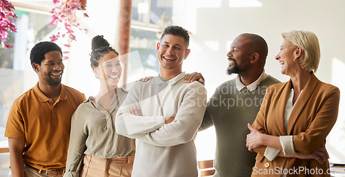 Image of Portrait, support and arms crossed with a business team in the office for leadership, unity or solidarity. Collaboration, smile and diversity with a happy employee group in the workplace for success