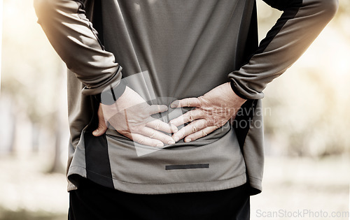 Image of Runner, hands and back pain in park, injury or outdoor for fitness, training or muscle emergency. Person, spine accident and exercise for osteoporosis, fibromyalgia or arthritis in nature for workout