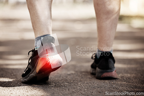 Image of Feet, running person with red pain overlay for fitness, health or exercise and cardio injury, risk and sports muscle. Runner or athlete legs and foot in shoe for training or workout fatigue in street