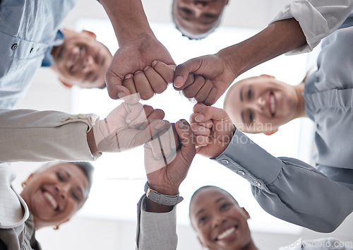 Image of Hands fist bump, group circle and business people celebrate community support, synergy or happy corporate achievement. Below view, trust and staff commitment, solidarity and team building motivation