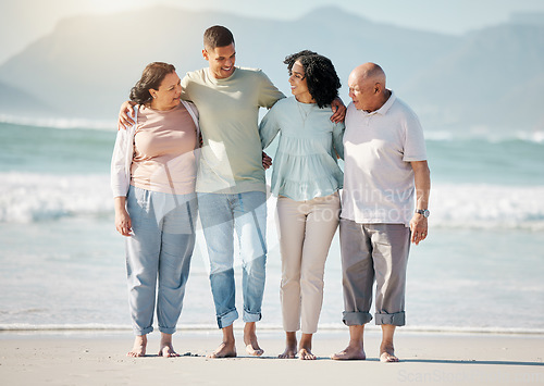 Image of Happy family, beach and couple with senior parents hug, walk and bond in nature together. Walking, love and laughing elders with with man and woman at sea for retirement, travel and visit in Bali