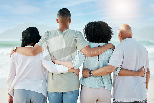 Image of Back, hug and family at the beach for the view, ocean vacation and love in summer. Calm, nature and senior people with a man and woman for care and support in travel at the sea for a holiday together