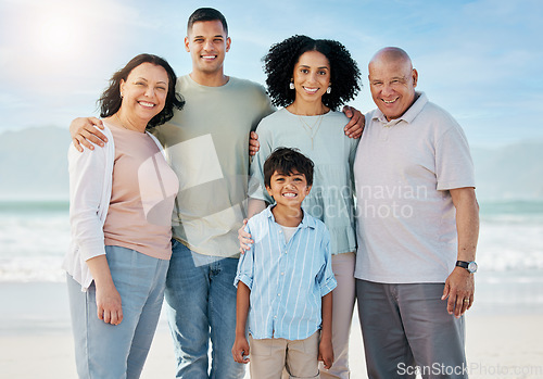 Image of Portrait, grandparents and a family on the beach in summer together for holiday or vacation by the ocean. Love, nature or freedom with parents and children at the sea for bonding or weekend travel