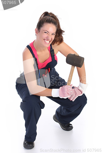 Image of woman with black rubber mallet 