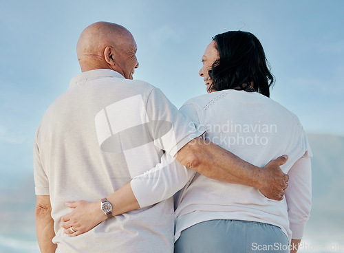 Image of Back, love and hug with old couple at beach for travel, support and summer vacation. Relax, bonding and retirement with senior man and woman on seaside holiday for trust, health and marriage together