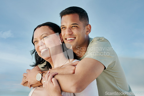 Image of Love, hug and man with senior mother at beach happy, bond and relax in nature together. Face, smile and male with mom the ocean for freedom, travel and adventure, trip or family holiday in Mexico