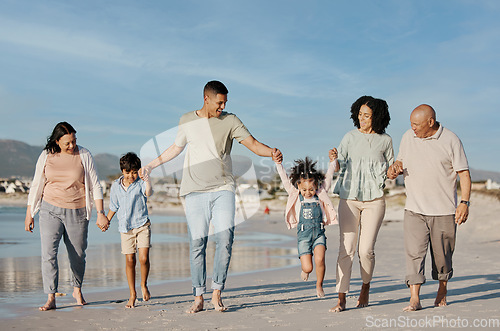 Image of Walking, happy and family outdoor on a beach with love, care and happiness on travel vacation. Parents, grandparents or men and women holding hands of children for holiday, journey or fun adventure