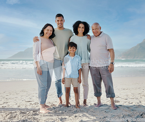 Image of Portrait, grandparents and a family on the beach in nature together for holiday or vacation by the ocean. Love, summer or freedom with parents and children at the sea for bonding or weekend travel