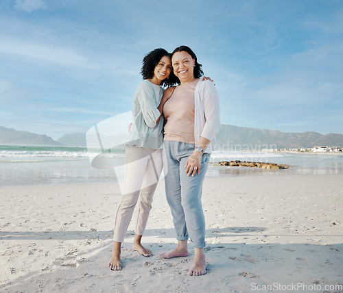 Image of Hug, portrait and woman with mother at a beach happy, bond and relax in nature together. Love, smile and lady face with mom the ocean for freedom, travel and adventure trip at the sea in South Africa