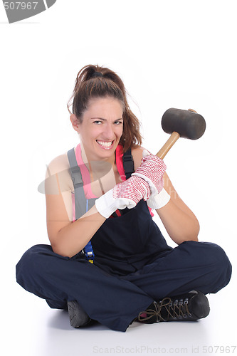 Image of woman with black rubber mallet 