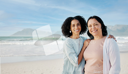 Image of Portrait, hug and woman with mother at a beach happy, bond and relax in nature together. Love, smile and lady face with mom the ocean for freedom, travel and adventure trip at the sea in South Africa