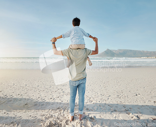 Image of Dad, child on beach and piggy back together in summer waves on tropical island holiday in Hawaii. Fun, father and son on ocean vacation with love, support and relax at water with blue sky from back.