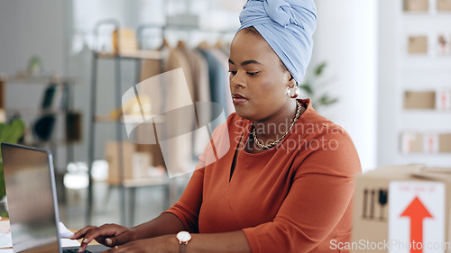 Image of Black woman, laptop and typing in logistics for schedule delivery, order or ecommerce in fashion business. African American female working on computer in digital marketing for shipping information
