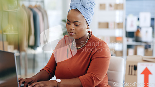 Image of Black woman, laptop and typing in logistics for schedule delivery, order or ecommerce in fashion business. African American female working on computer in digital marketing for shipping information