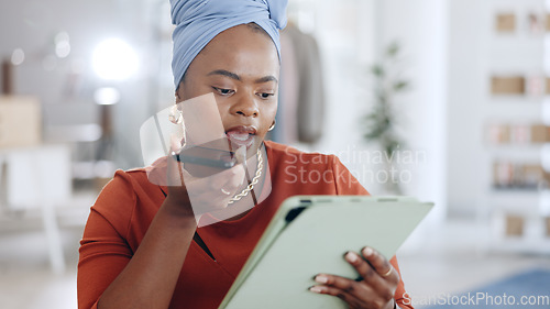 Image of Phone call, tablet and business woman in the office while doing research for a corporate project. Cellphone, professional and African female employee on a mobile conversation in the modern workplace.