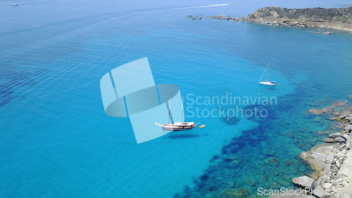 Image of Aerial of yacht on blue water, sailing in Croatia and summer sun on ocean holiday, relax in freedom and nature seascape. Boat vacation, travel and tropical cruise on sea adventure to island coast.