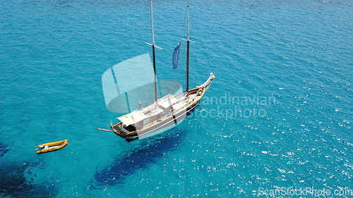 Image of Yacht, sailing in Croatia and sun on ocean holiday, relax in freedom and nature with clean blue water from above. Boat vacation, travel in summer and tropical cruise on sea adventure with island fun.