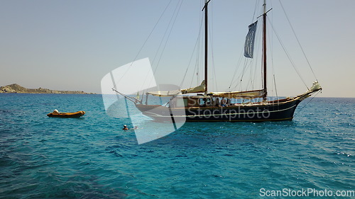 Image of Yacht, sailing in Greece and summer on ocean holiday, relax in freedom and nature on blue water. Boat vacation, travel in sun and tropical cruise on sea adventure to island coast in beach transport.