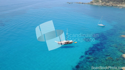 Image of Boat on blue water, sailing in Croatia and summer sun on ocean holiday, relax in freedom and nature seascape. Yacht vacation, fun travel and tropical cruise on sea adventure to aerial island coast.