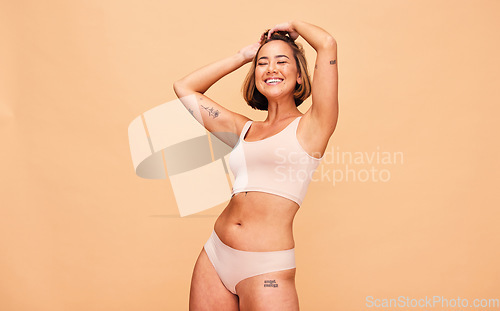 Image of Happy, lingerie and body of woman in studio isolated on a brown background mockup space. Smile, underwear and model in natural beauty, self love and confidence for positivity, health and wellness