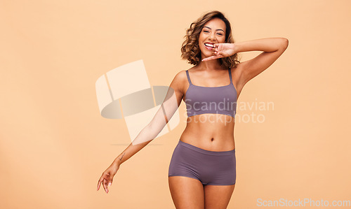 Image of Happy portrait, lingerie and body of woman in studio isolated on brown background mockup space. Smile, underwear and model in natural beauty, self love or confidence in positivity, health or wellness