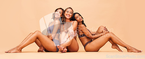 Image of Beauty, group and happy women sitting with makeup for cosmetic skincare isolated in a studio brown background. Skin, aesthetic and portrait of friends together for self care, dermatology and support