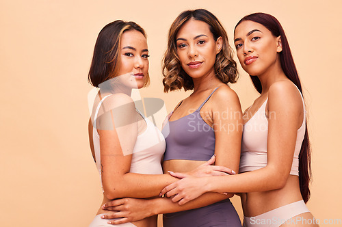 Image of Beauty, group and portrait of women with makeup for cosmetic skincare isolated in a studio brown background. Skin, aesthetic and young friends together for self care, dermatology and support