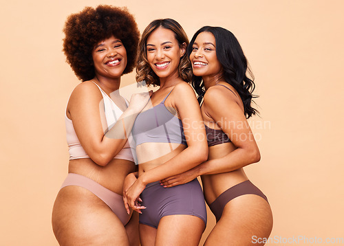 Image of Diversity, body positivity and portrait of women with smile, self love and solidarity in studio together. Happiness, group of people on beige background with underwear, skincare and cosmetic equality