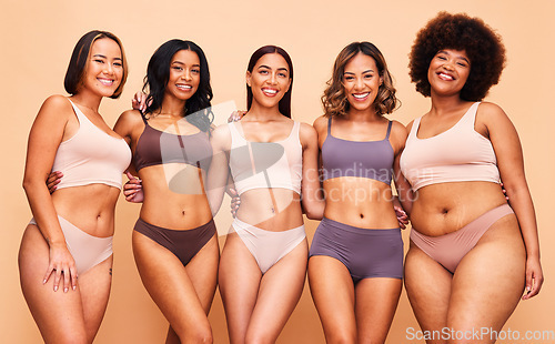 Image of Underwear, self love and portrait of women in studio for wellness, beauty and body positive campaign. Diversity, natural and people on brown background for confidence, skincare and lingerie inclusion