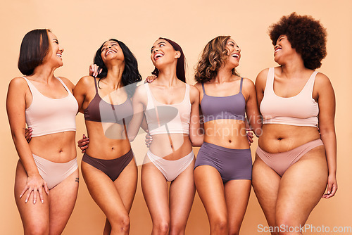 Image of Body positive, happy and women in studio in underwear for wellness, beauty and self love campaign. Diversity, natural skin and people in lingerie on brown background for confident, pride or inclusion